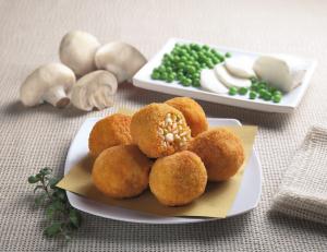 Breaded rice balls with mushrooms and peas (arancini)