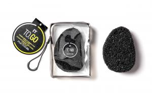 Body sponge with activated charcoal in travel bag