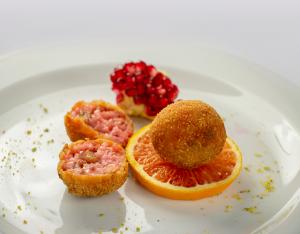 Arancinette with spritz and smoked tuna