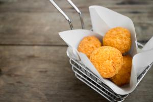 Arancinette with orange zest and smoked salmon