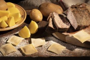 Frozen fresh ravioli with potatoes from Calabria and calabrian black pork meat