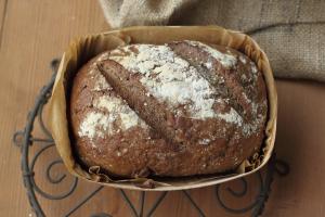 Dark rye bread (in the wooden tray)
